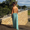 Ankle-length summer dress featuring halter neck, bare back, and waist openings
