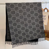Reversible cashmere fringe shawl showcasing a luxurious blend of style and warmth.