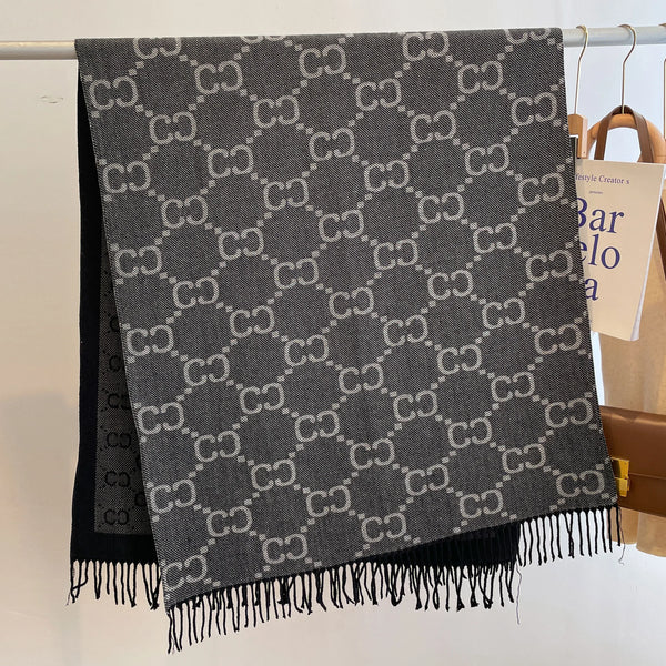Reversible cashmere fringe shawl showcasing a luxurious blend of style and warmth.
