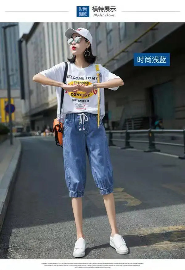 Relaxed harem jeans featuring high waistband and functional pocket design
