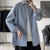Oversized long sleeve casual shirt for men and women, featuring a Mandarin collar and single-breasted closure in solid color.