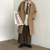 Chic Japanese vintage trench coat for men in black, featuring a single-breasted closure and stylish turn-down collar.