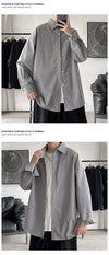 Oversized long sleeve casual shirt for men and women, featuring a Mandarin collar and single-breasted closure in solid color.