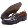 Pair of black formal loafers showing custom-fit leather construction