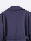 Polyester trench coat featuring double-breasted front and waist belt