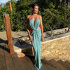 Sophisticated polyester dress featuring backless halter design with waist cutouts