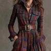 Model wearing the Autumn Whispers Plaid Maxi dress, highlighting its flattering silhouette and deep pockets.