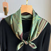 Soft and comfortable vintage green scarf, ideal as a headscarf or hair accessory.
