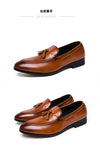 Elegant black loafers on a marble floor, highlighting their sophisticated style.