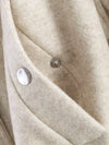 Belted Elegance jacket with relaxed fit and sophisticated turtleneck styling