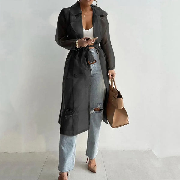 Sheer white trench coat with belt and single-breasted button front for spring layering
