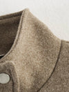 Belted outerwear with relaxed fit perfect for layering over sweaters and dresses