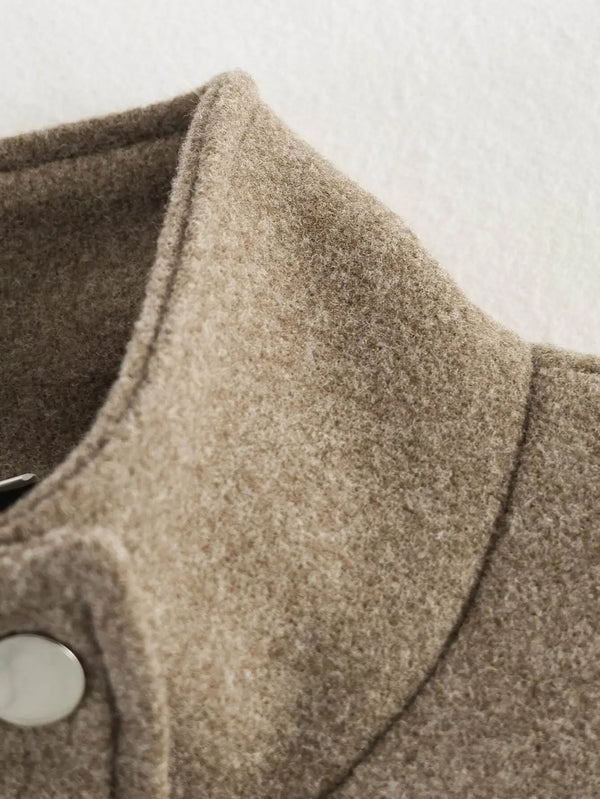 Belted outerwear with relaxed fit perfect for layering over sweaters and dresses