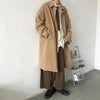 Chic Japanese vintage trench coat for men in black, featuring a single-breasted closure and stylish turn-down collar.