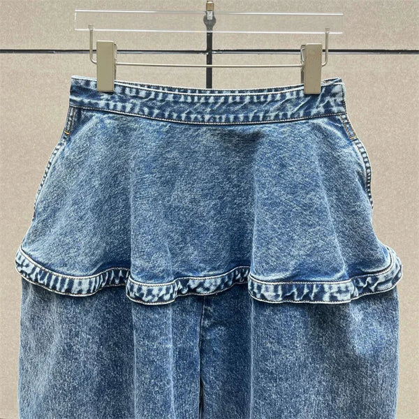 Light wash denim jeans featuring early 2000s style wide leg cut and ankle length