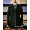 Vintage tweed herringbone men's blazer with four pockets, notched collar, and single-breasted design for stylish occasions.