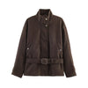 Loose-fit jacket with elegant turtleneck and defining waist belt on model