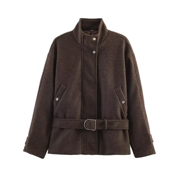 Loose-fit jacket with elegant turtleneck and defining waist belt on model