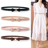 Elegant women's belt with bow detail in faux leather, perfect for casual and formal outfits, featuring a sleek metal buckle.