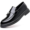 Waterproof black dress loafers featuring decorative tassels and durable rubber outsole for all-day comfort