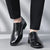 Black round toe formal dress shoes with lace-up closure on white background