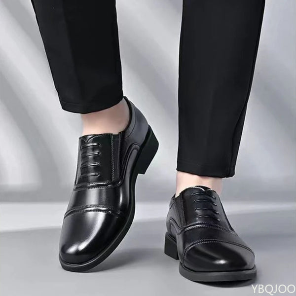 Black round toe formal dress shoes with lace-up closure on white background