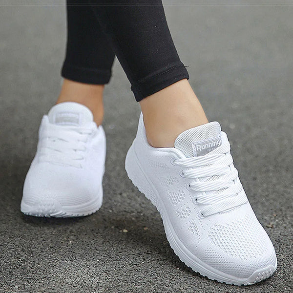 White lace-up sports sneakers with rainbow accents for active women