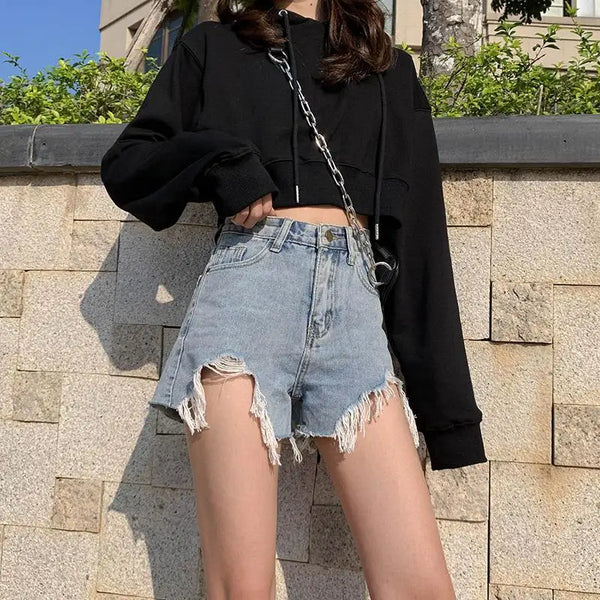Distressed denim shorts with high rise waist and loose comfort fit for summer wear