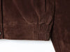 Warm brown polyester jacket with sophisticated turtleneck and storage pockets