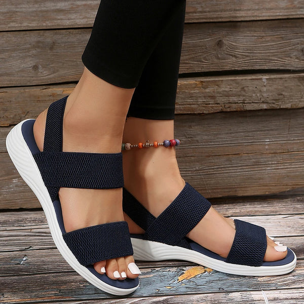 Comfortable spring sandals featuring stretchy knit material and supportive wedge heel