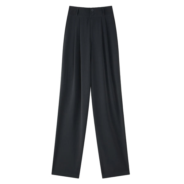 Close-up of decorative button details and high-waist construction on sophisticated wide leg trousers