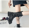 Chic mid-calf motorcycle boots for women, featuring lace-up closure, non-slip outsole, and stylish PU leather design.