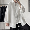Oversized long sleeve casual shirt for men and women, featuring a Mandarin collar and single-breasted closure in solid color.