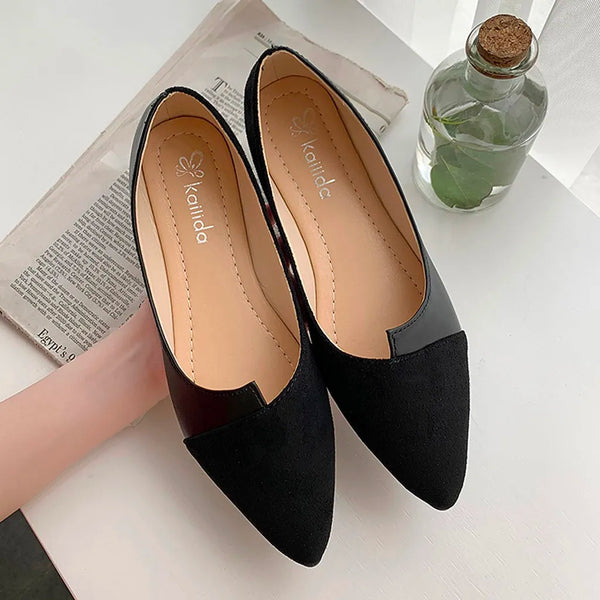 Close-up of ballet flat heel and sole construction with rubber insole