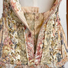 Elegant backless design of the linen dress, ideal for memorable entrances at garden parties.