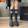 Chic women's knee-high boots with thick sole, stylish PU upper, and rounded toe for winter elegance and comfort.
