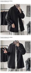Oversized long sleeve casual shirt for men and women, featuring a Mandarin collar and single-breasted closure in solid color.