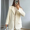 Flat lay of creamy white mohair blazer showing full design and classic tailoring details