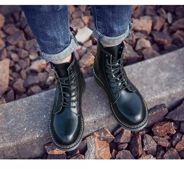 Black leather motorcycle gear boots for ultimate protection.
