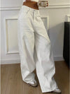 White high waist wide leg denim jeans with functional pockets and flowing silhouette