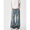 Trendy washed and ripped wide-leg women's jeans with ink-splashed finish, mid-rise, and comfortable cotton-spandex blend.