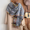Close-up of the plush polyester texture of the Winter's Whisper scarf.