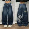 Trendy wide-leg jeans with unique patterns for fashionable wear.