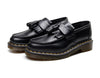 Black tassel loafers that enhance your wardrobe's investment.