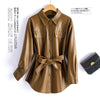 Chic women's sheepskin leather jacket with turn-down collar, lace-up belt, and adjustable waist for a stylish fit.