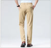 Black stretch business pants with flat front design and secure zipper closure