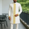 Side angle of African heritage outfit showing relaxed fit and patchwork panel placement