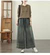 Vintage embroidered wide-leg jeans for women, featuring elastic waist, ethnic design, and light wash for autumn fashion.