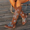 Embroidered mid-calf women's fashion boots with low wedge heel, slip-on design, and durable rubber outsole for comfort.