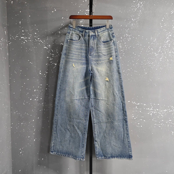 Wide leg men's jeans in washed blue featuring vintage-style finish